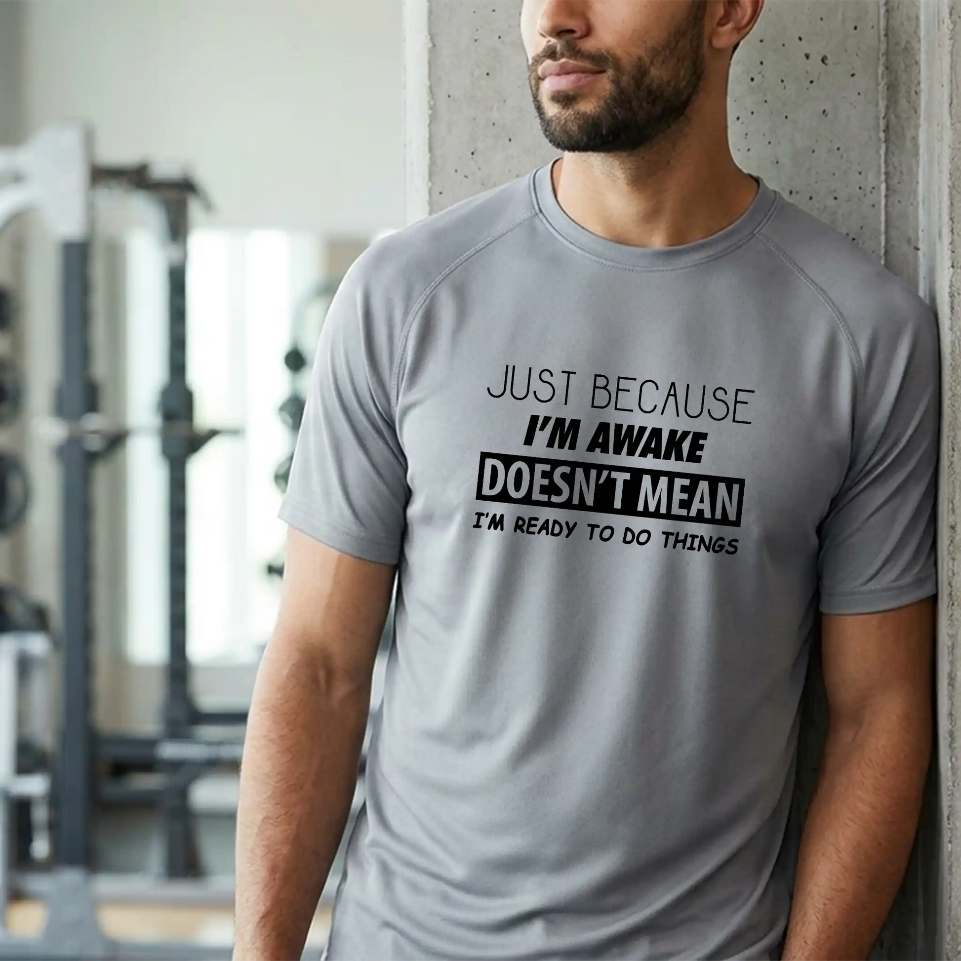 Male model wearing the 'Just Because I'm Awake' short-sleeve Platinum performance shirt - Humorous gift for morning people and runners.