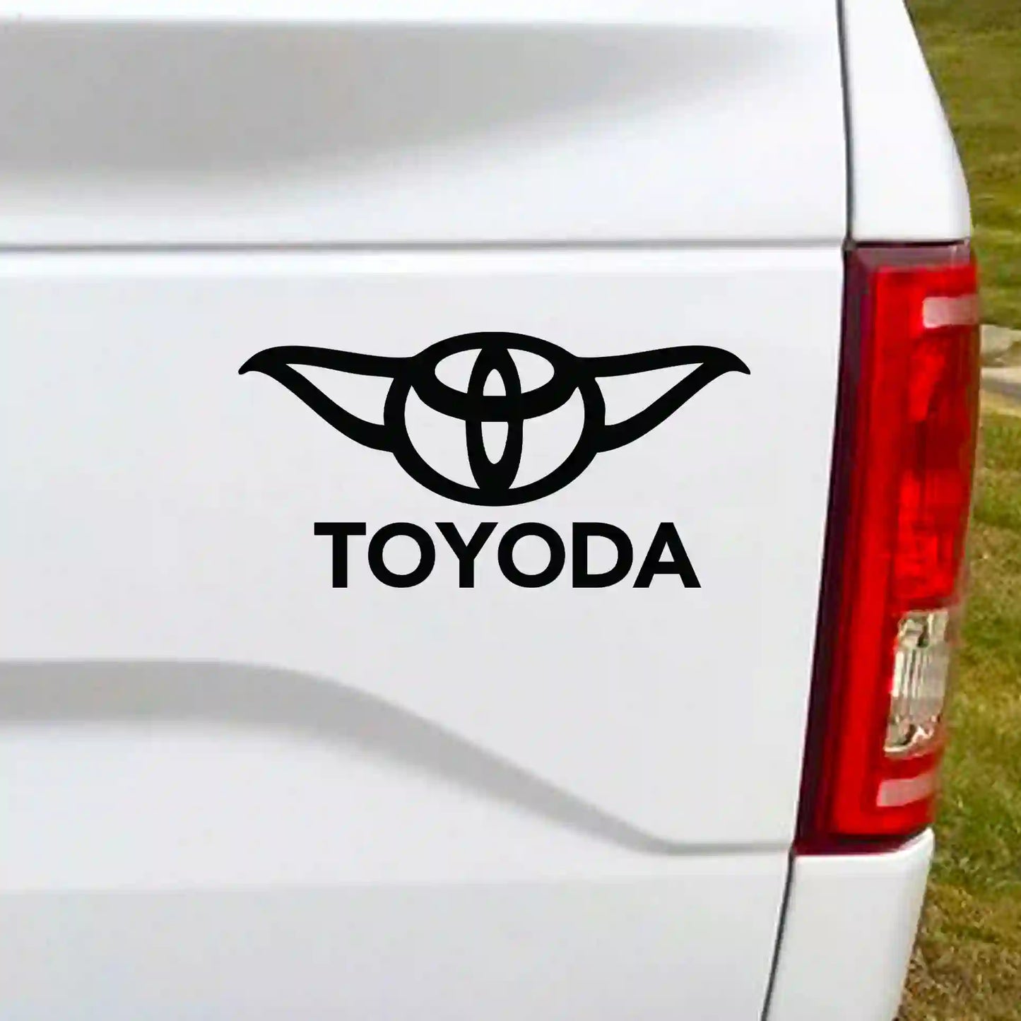 Black vinyl decal featuring a mashup of a classic 4x4 logo with science fiction ears and the text "Toyoda" in a stylized font.